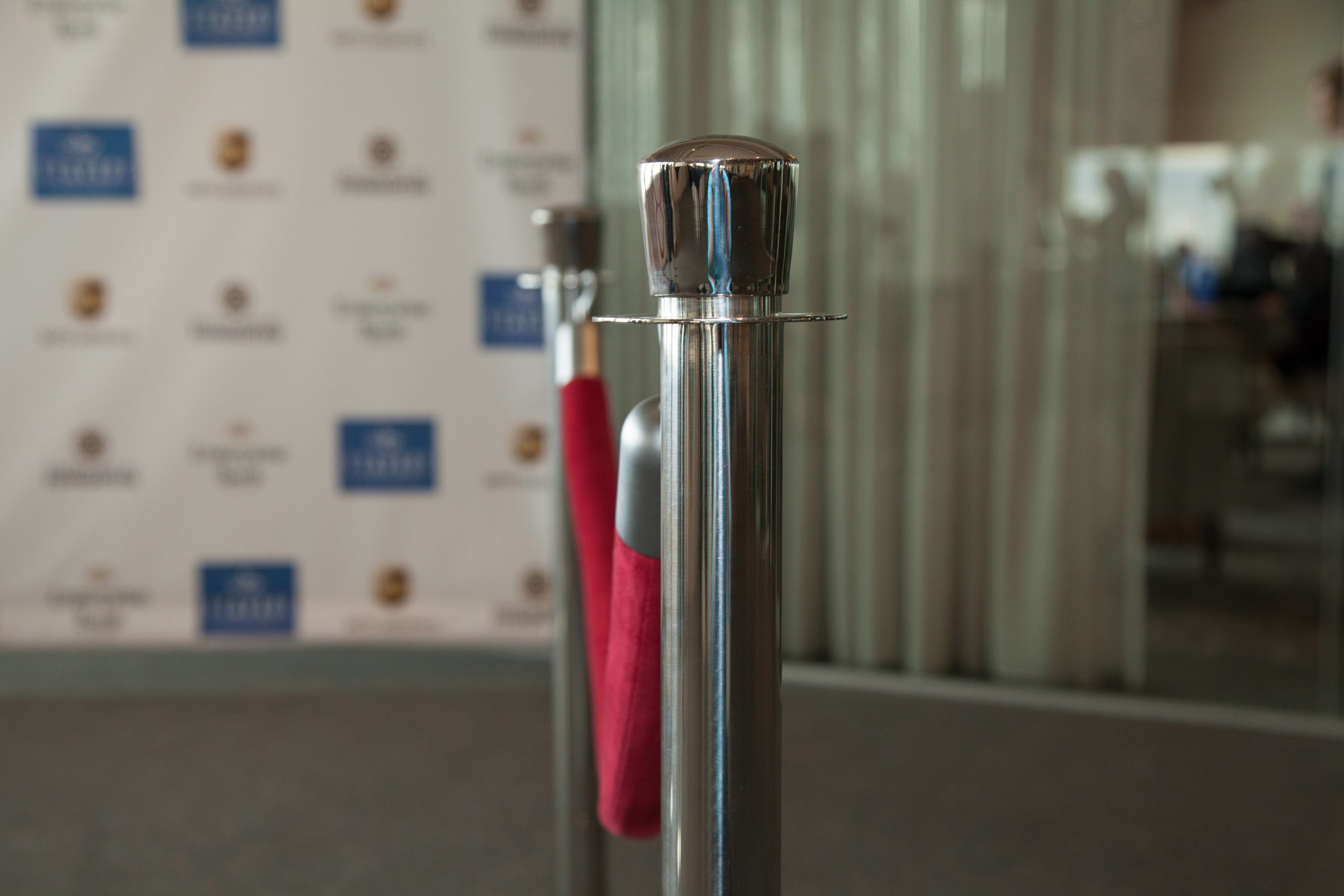 Sponsor logos on a backdrop at an NILP event